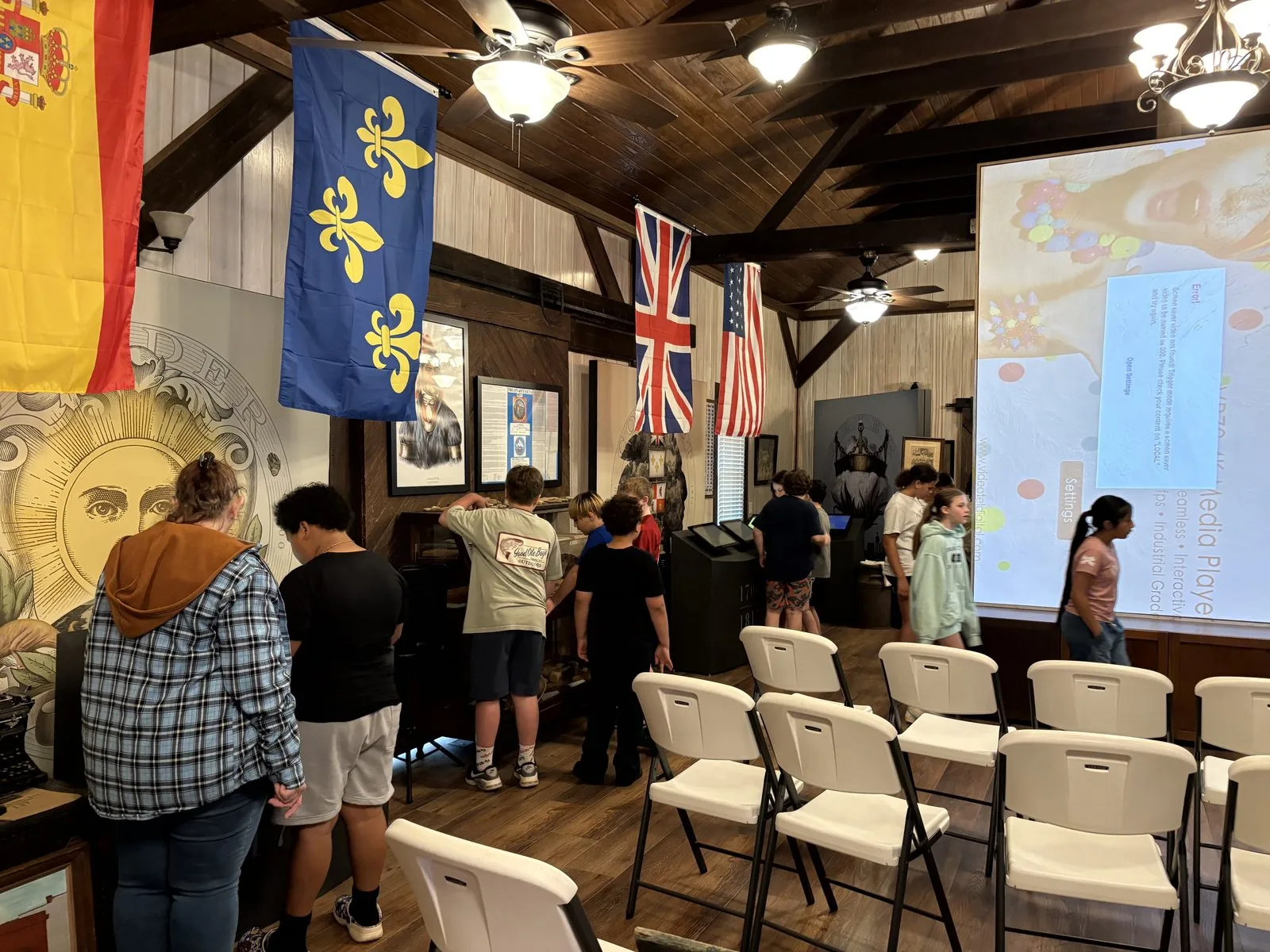 A class discovers the Cargo Room beneath the flags of Alabama's history