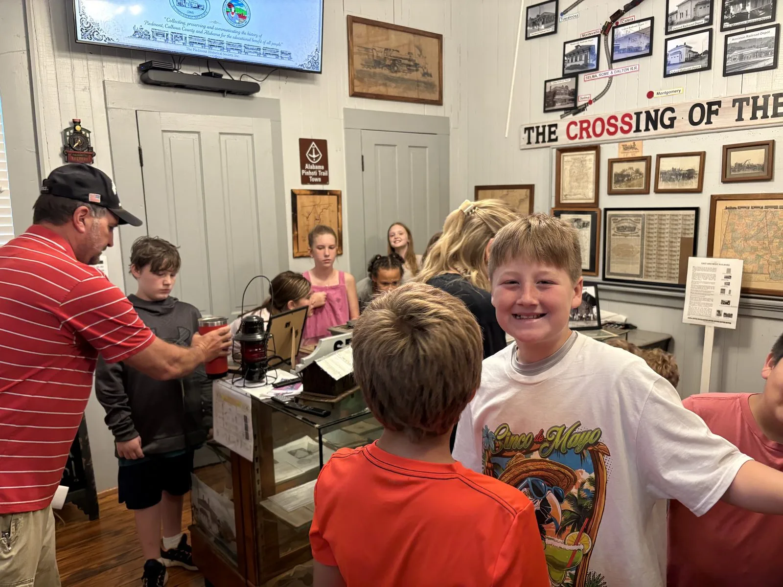 Students explore the Railroad Room with a museum guide