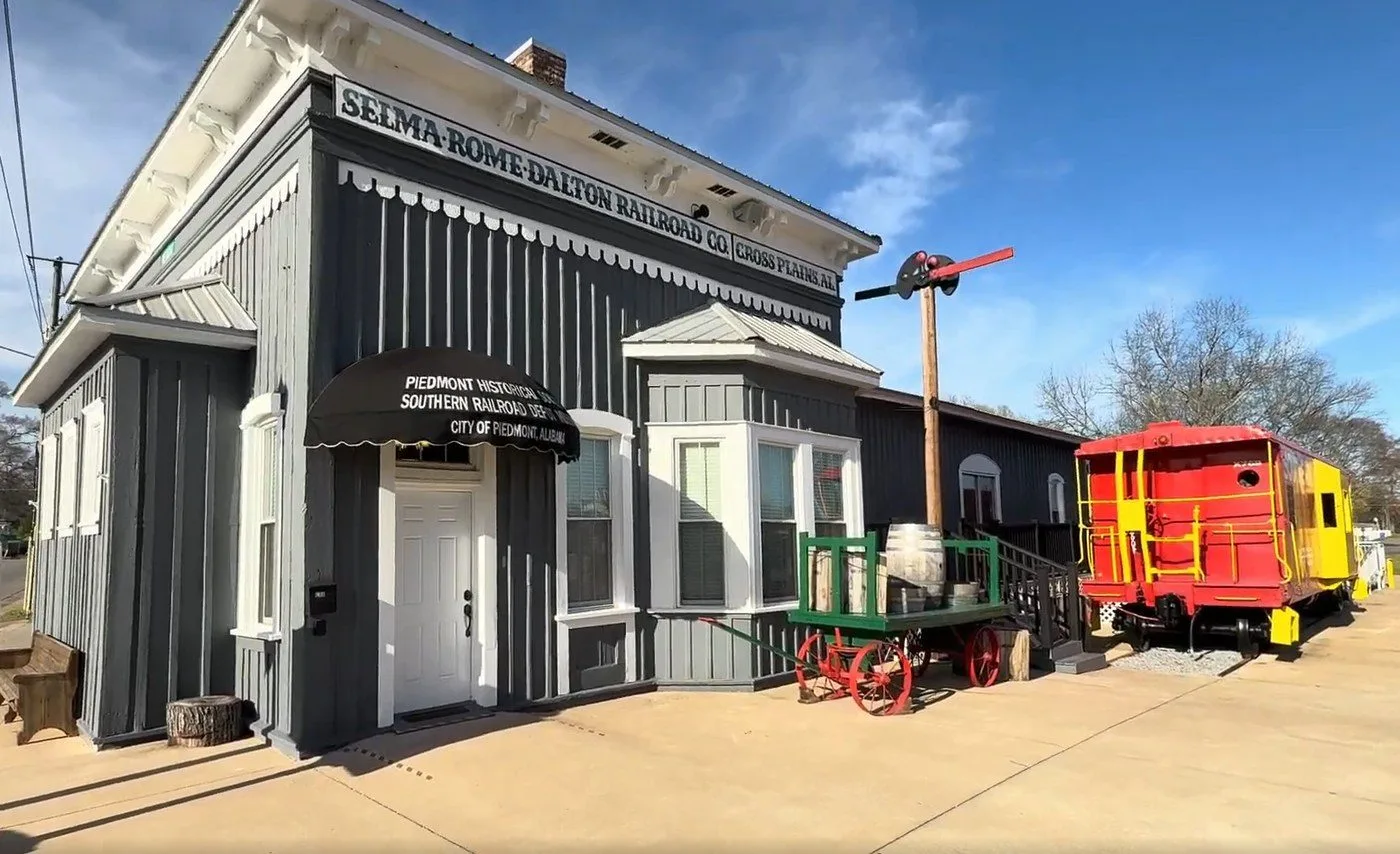 The restored 1868 Southern Railroad depot with its red-and-yellow caboose