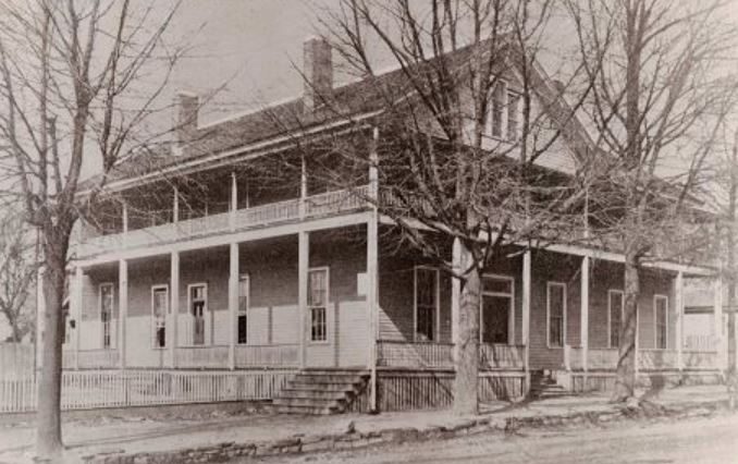 The wooden Albert House hotel with double porches