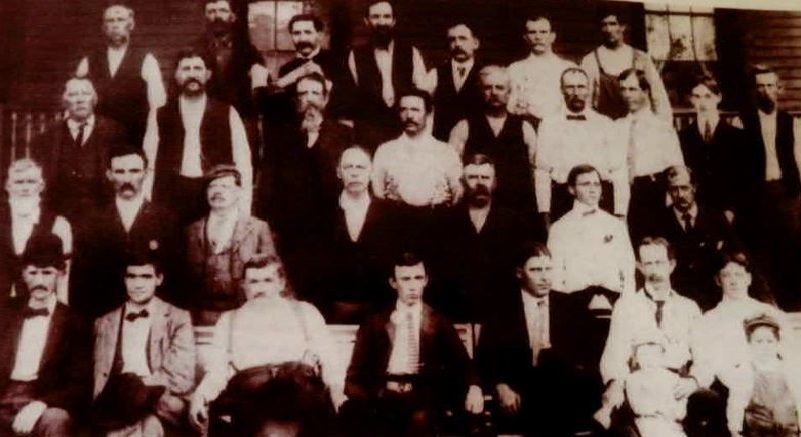 The men of Cross Plains posed on a downtown porch
