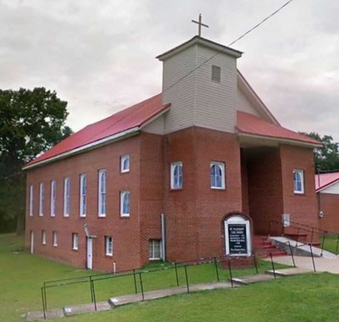 The brick Mt. Pleasant Christian Methodist Episcopal Church with its red roof and bell tower
