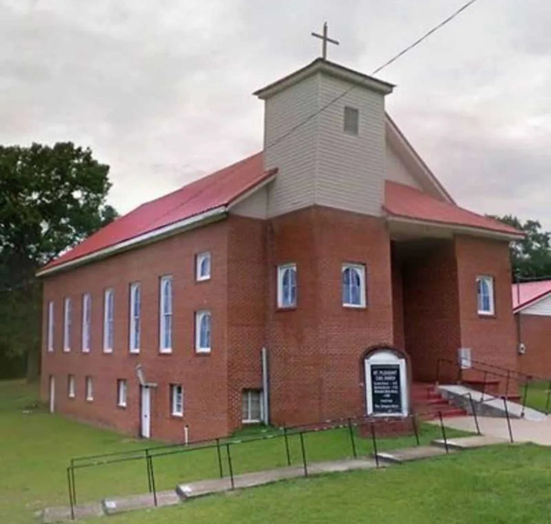 The brick Mt. Pleasant Christian Methodist Episcopal Church with a red roof